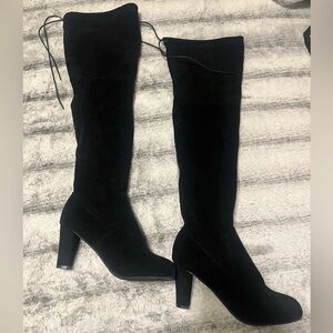 Size 7.5 thigh high black heels. Felt material.